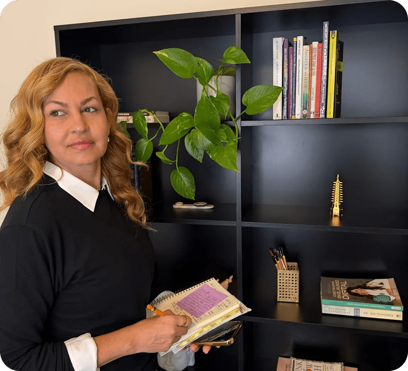 Person standing near a black shelf