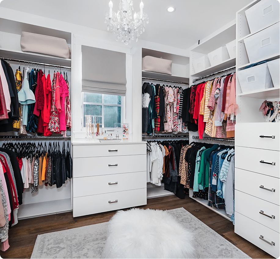 Spacious wardrobe with hanging clothes and storage